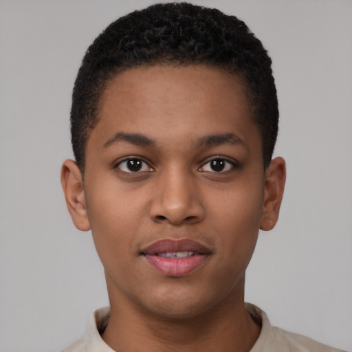 Joyful black young-adult male with short  brown hair and brown eyes
