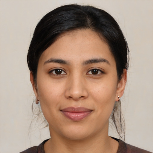 Joyful asian young-adult female with medium  brown hair and brown eyes