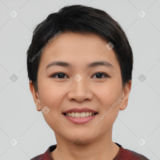 Joyful asian young-adult female with short  black hair and brown eyes