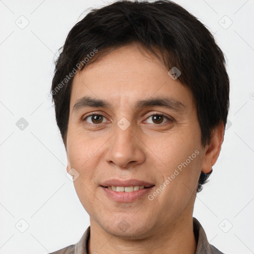 Joyful white adult male with short  brown hair and brown eyes