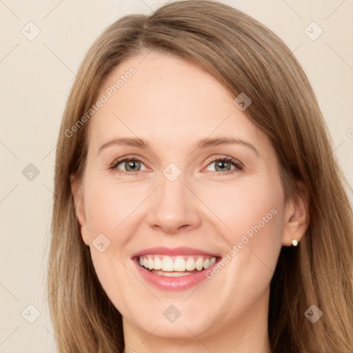 Joyful white young-adult female with long  brown hair and green eyes