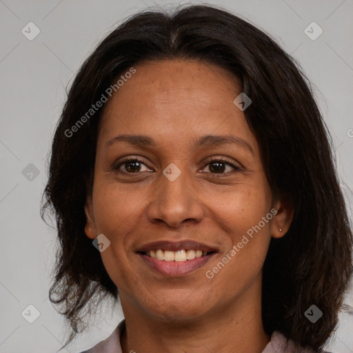 Joyful white adult female with medium  brown hair and brown eyes