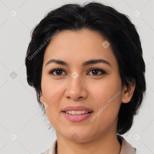 Joyful latino young-adult female with medium  black hair and brown eyes