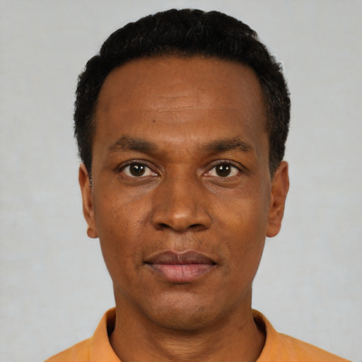 Neutral black young-adult male with short  black hair and brown eyes