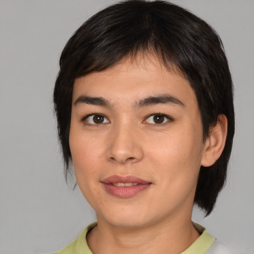 Joyful white young-adult female with medium  black hair and brown eyes