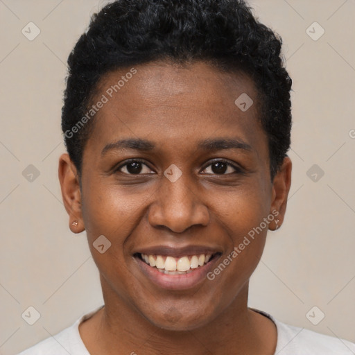 Joyful black young-adult female with short  brown hair and brown eyes