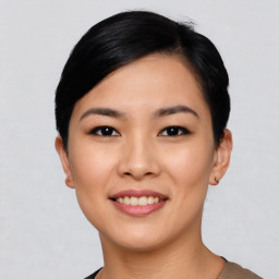 Joyful asian young-adult female with short  black hair and brown eyes