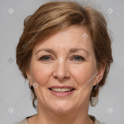 Joyful white adult female with medium  brown hair and grey eyes