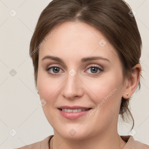 Joyful white young-adult female with medium  brown hair and grey eyes