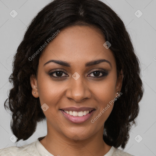 Joyful black young-adult female with medium  brown hair and brown eyes