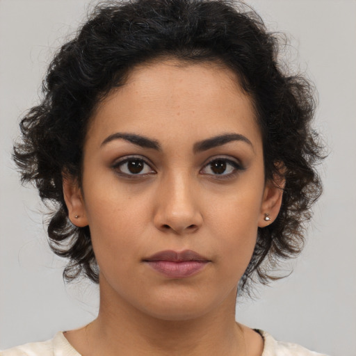 Neutral latino young-adult female with medium  brown hair and brown eyes