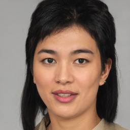 Joyful asian young-adult female with medium  black hair and brown eyes