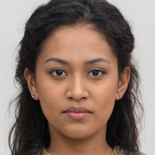 Neutral latino young-adult female with long  brown hair and brown eyes