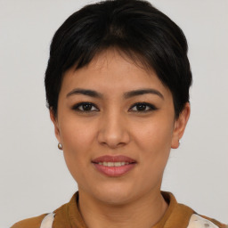 Joyful asian young-adult female with short  black hair and brown eyes