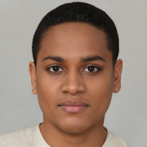 Joyful black young-adult female with short  brown hair and brown eyes