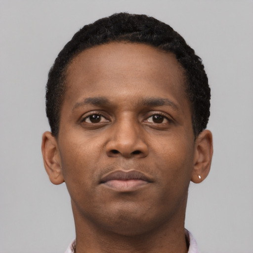 Neutral black young-adult male with short  brown hair and brown eyes