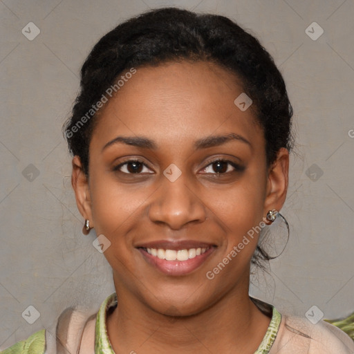 Joyful black young-adult female with short  black hair and brown eyes