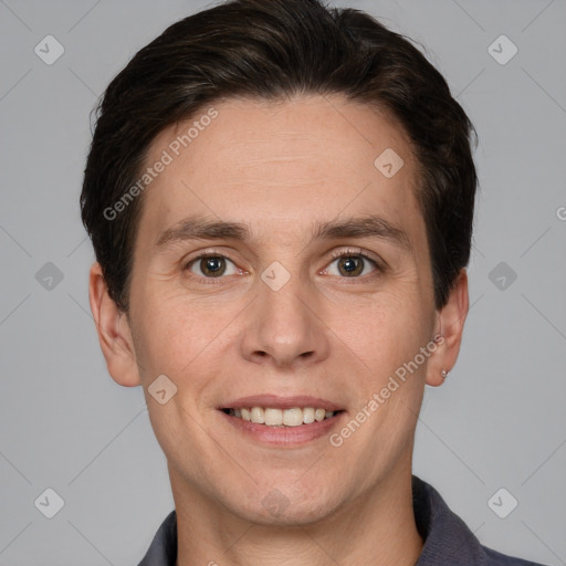 Joyful white adult male with short  brown hair and grey eyes