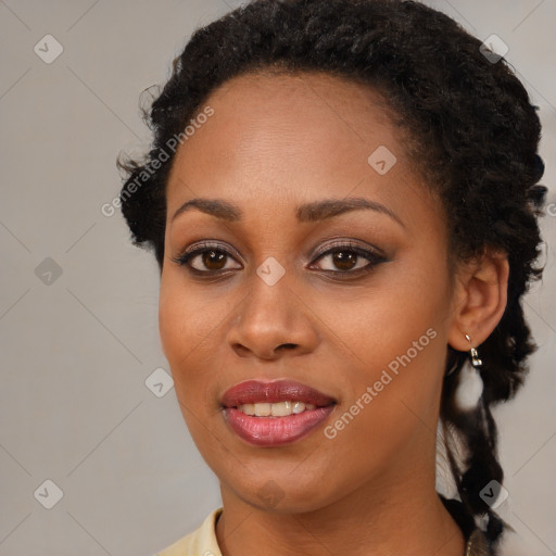 Joyful black young-adult female with medium  black hair and brown eyes