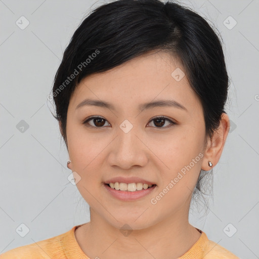 Joyful asian young-adult female with medium  brown hair and brown eyes