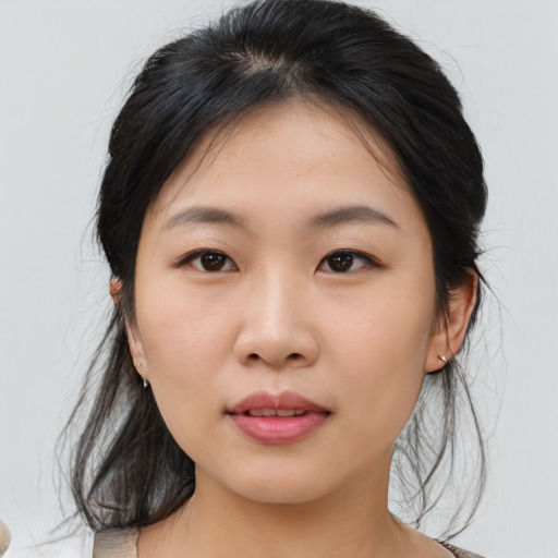 Neutral asian young-adult female with medium  brown hair and brown eyes