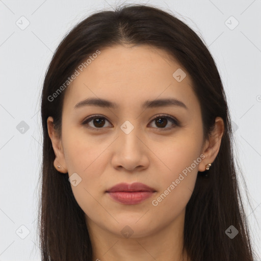 Joyful latino young-adult female with long  brown hair and brown eyes