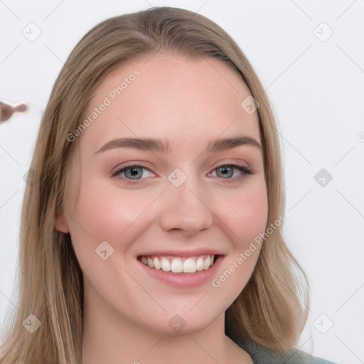 Joyful white young-adult female with long  brown hair and blue eyes