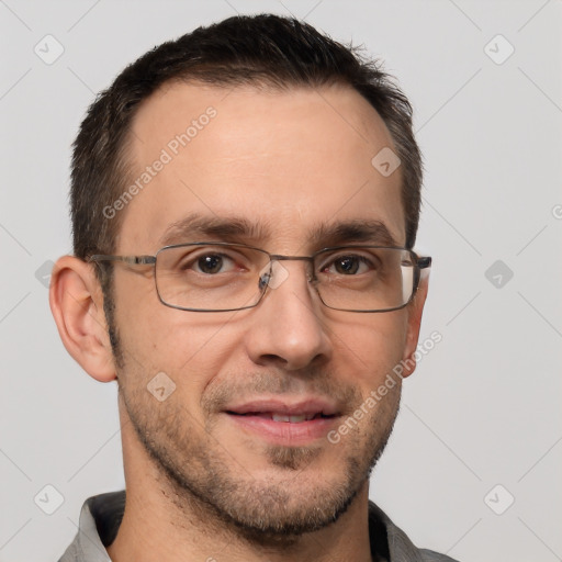 Joyful white adult male with short  brown hair and brown eyes