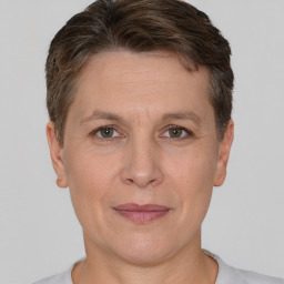 Joyful white adult female with short  brown hair and brown eyes