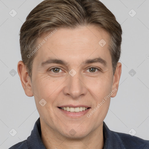 Joyful white adult male with short  brown hair and brown eyes