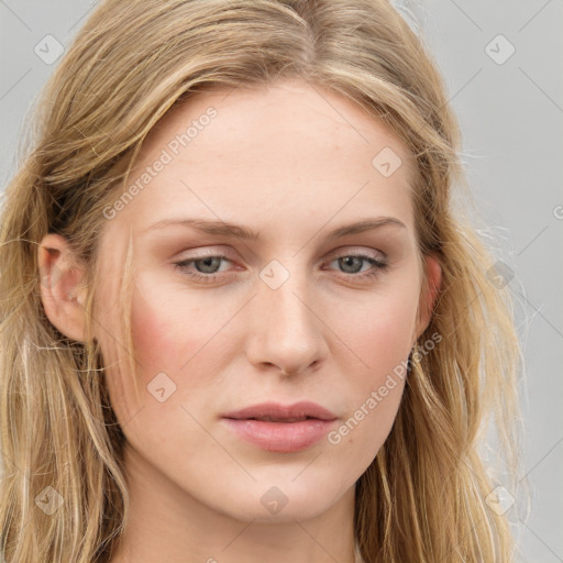 Joyful white young-adult female with long  brown hair and blue eyes