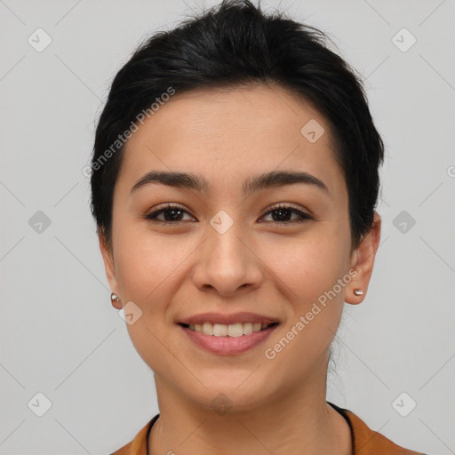 Joyful asian young-adult female with short  black hair and brown eyes