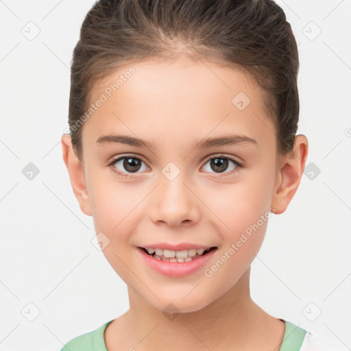 Joyful white child female with short  brown hair and brown eyes