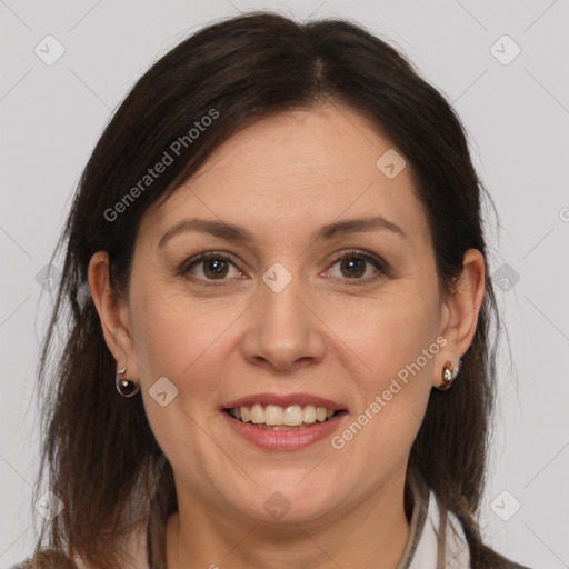 Joyful white adult female with medium  brown hair and brown eyes