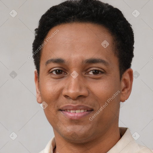 Joyful latino young-adult male with short  brown hair and brown eyes