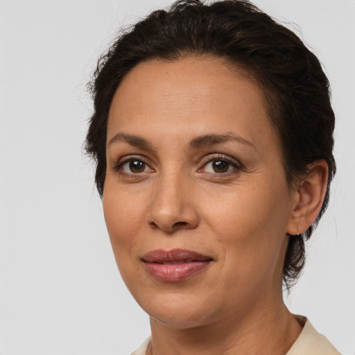 Joyful white adult female with short  brown hair and brown eyes