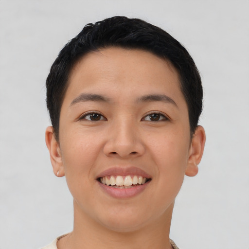 Joyful asian young-adult female with short  black hair and brown eyes