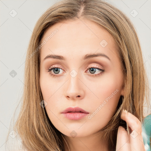 Neutral white young-adult female with long  brown hair and brown eyes