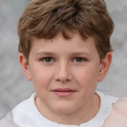 Joyful white child male with short  brown hair and brown eyes