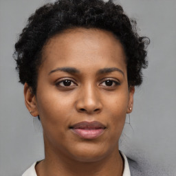 Neutral black young-adult female with short  brown hair and brown eyes