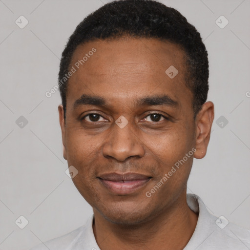 Joyful latino adult male with short  black hair and brown eyes