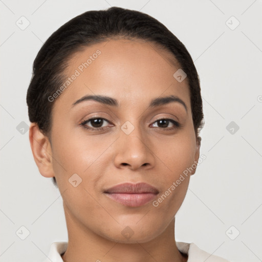 Joyful latino young-adult female with short  brown hair and brown eyes