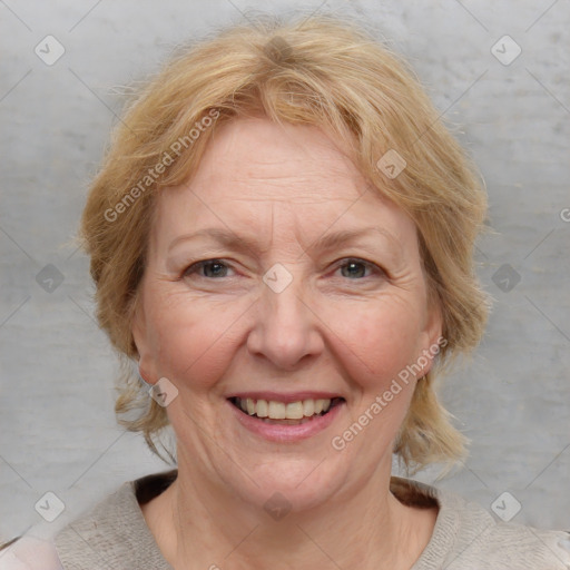 Joyful white adult female with medium  brown hair and blue eyes