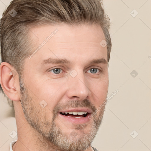 Joyful white adult male with short  brown hair and grey eyes