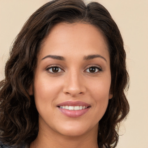 Joyful white young-adult female with long  brown hair and brown eyes