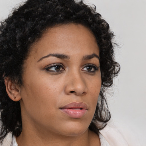Neutral latino young-adult female with medium  brown hair and brown eyes