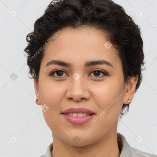 Joyful latino young-adult female with short  brown hair and brown eyes