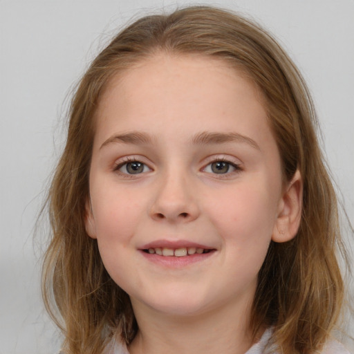 Joyful white child female with medium  brown hair and blue eyes