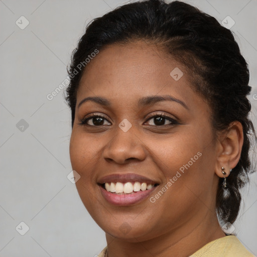 Joyful black young-adult female with medium  brown hair and brown eyes