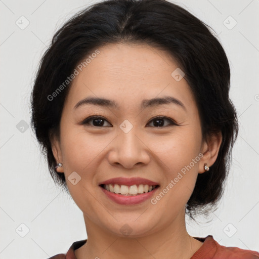 Joyful asian young-adult female with medium  brown hair and brown eyes